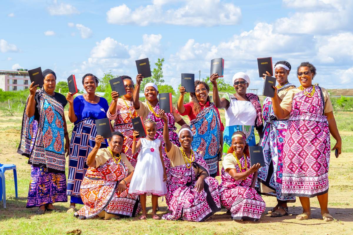 Group of people in Kenya holding Bibles.
